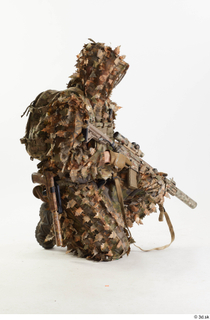 Frankie Perry in Ghillie kneeling with Gun holding gun kneeling…